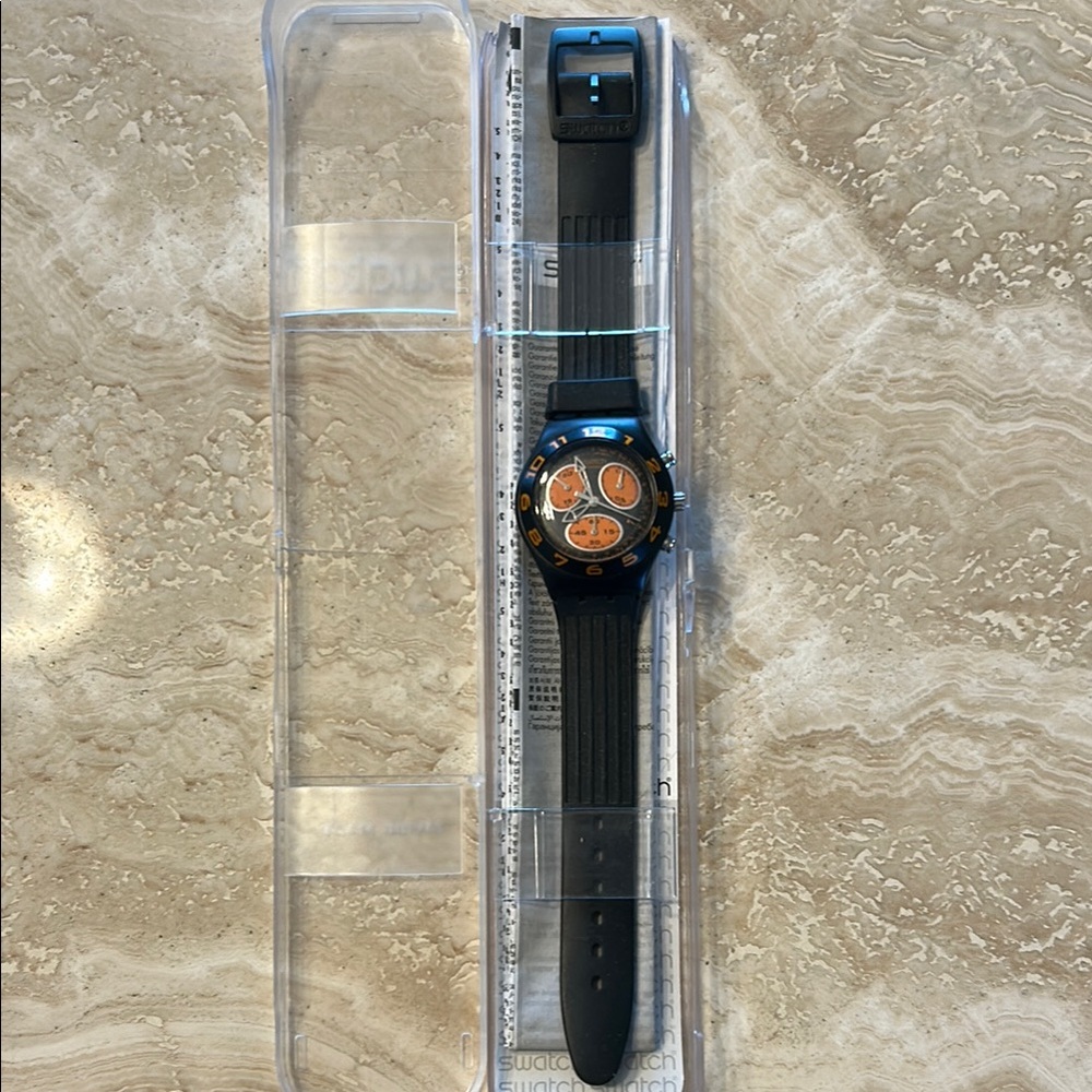 Swatch Black and Orange Smartwatch with Fitness Tracking